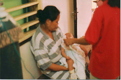 A picture of a baby that was brought into the Hinigran Emergency Clinic, with pneumonia. The hospital did not have any antibiotics to give the baby until our medical supplies arrived.